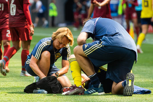 Lina Hurtig of Sweden receives treatment