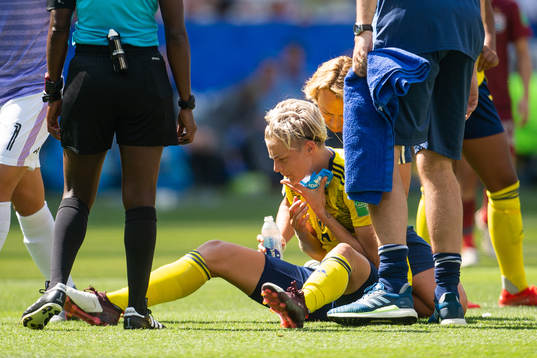 Lina Hurtig of Sweden receives medical attention