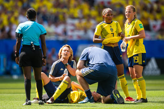 Lina Hurtig of Sweden receives medical attention
