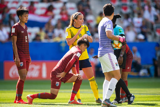 Kosovare Asllani of Sweden talks to the referee