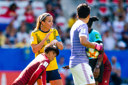 Kosovare Asllani of Sweden talks to the referee