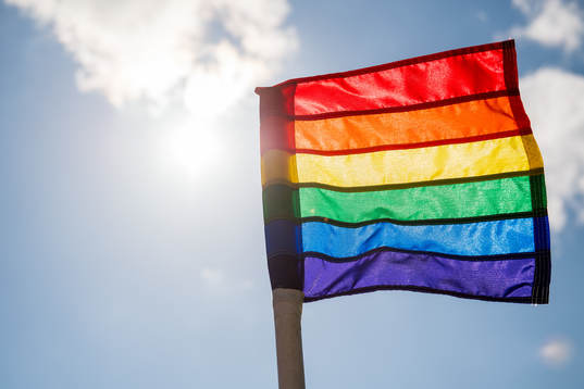 A rainbow-colored corner flag