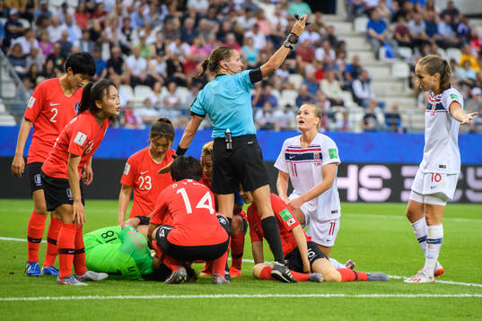 Goalkeeper Kim Minjung of South Korea in pain beside