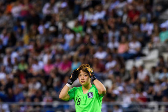 Goalkeeper Kim Minjung of South Korea looks dejected