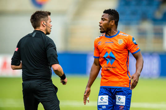 Tom Harald Hagen, referee, and Izunna Arnest Uzochukwu of