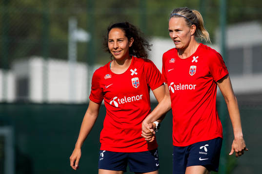 Ingrid Moe Wold and goalkeeper Ingrid Hjelmseth of Norway