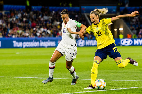 Carli Lloyd  of USA and Nathalie Björn of Sweden