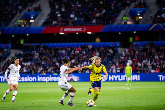 Carli Lloyd  of USA and Nathalie Björn of Sweden