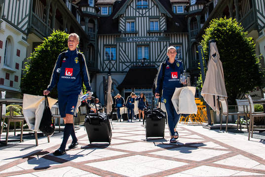 Caroline Seger and Olivia Schough of Sweden leave the team