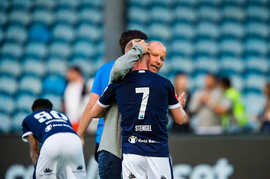Henrik Pedersen, head coach of Strømsgodset,  hugs Herman
