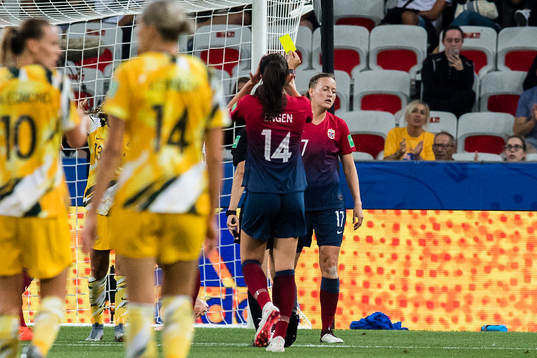 Kristine Minde of Norway gets a yellow card