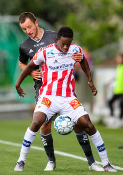 Even Hovland of Rosenborg and Mushaga Bakenga of Tromsø