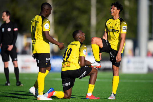 Parfait Bizoza and Ikhsan Fandi celebrate