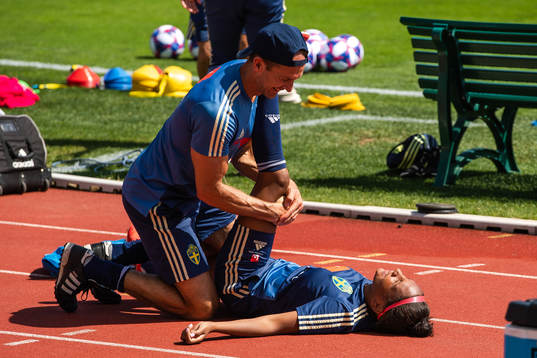 Madelen Janogy of Sweden receives treatment