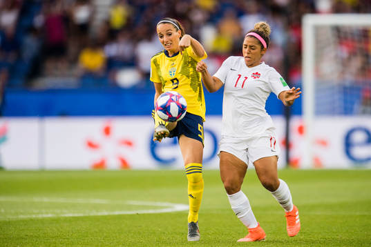 Kosovare Asllani of Sweden and Desiree Scott of Canada