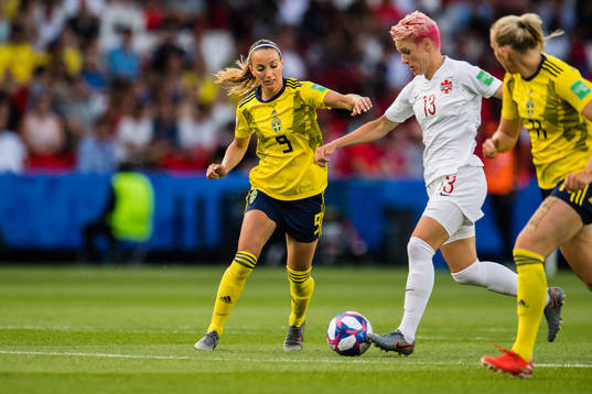 Kosovare Asllani of Sweden and Sophie Schmidt of Canada