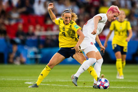 Kosovare Asllani of Sweden and Sophie Schmidt of Canada