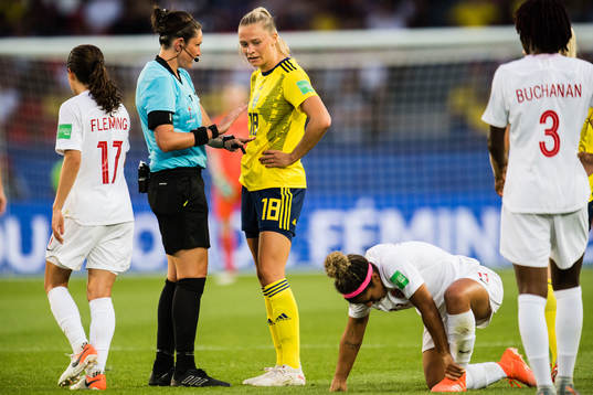 Fridolina Rolfö of Sweden gets a yellow card from Referee