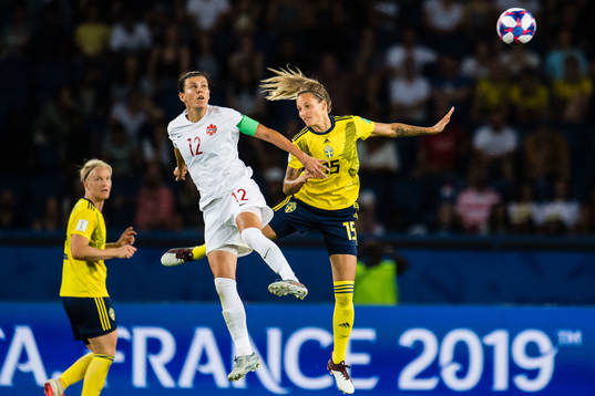 Christine Sinclair of Canada and Nathalie Björn of Sweden