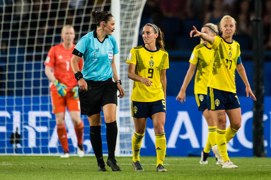 Referee Kate Jacewicz and Kosovare Asllani of Sweden