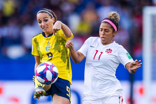 Kosovare Asllani of Sweden and Desiree Scott of Canada