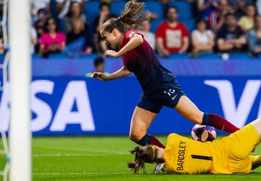 Guro Reiten of Norway and goalkeeper Karen Bardsley of
