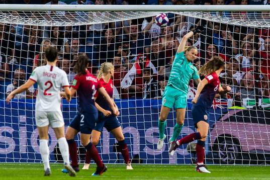 Lucy Bronze of England scores 0-3 behind goalkeeper Ingrid