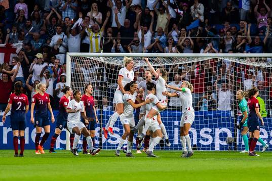 Lucy Bronze of England celebrate with teammates