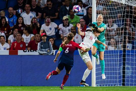 Ellen White of England and goalkeeper Ingrid Hjelmseth of