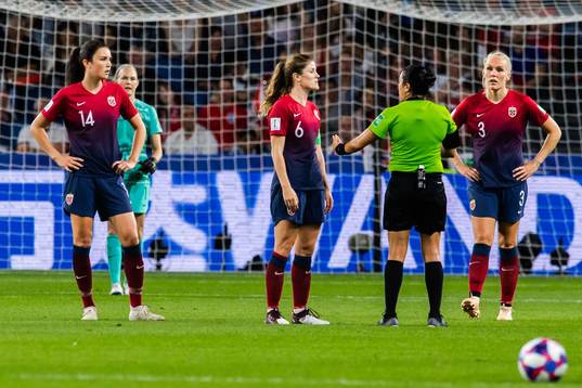 Maren Nævdal Mjelde of Norway in a discussion with referee