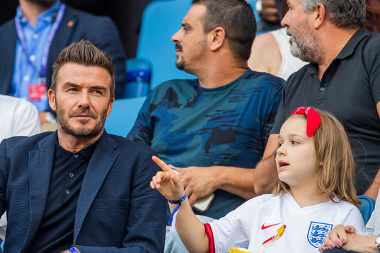 Former football player David Beckham with his daughter