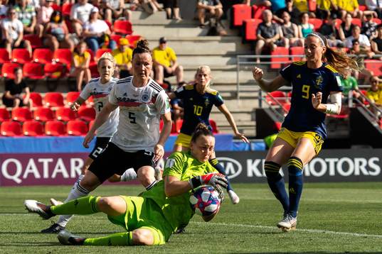 Goalkeeper Almuth Schult of Germany and Kosovare Asllani of