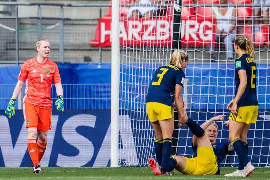 Nilla Fischer receives help from goalkeeper Hedvig Lindahl,