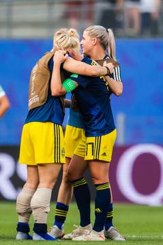 Nilla Fischer and Caroline Seger of Sweden celebrate