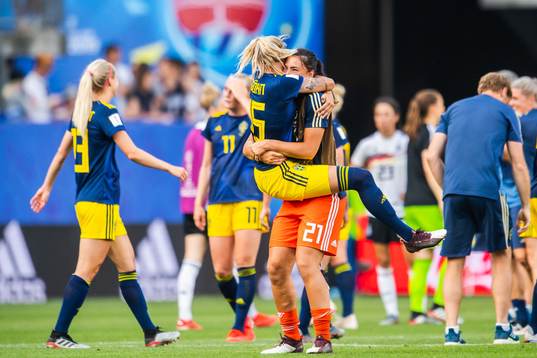 Nathalie Björn and goalkeeper Zecira Musovic of Sweden