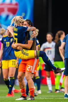 Nathalie Björn and goalkeeper Zecira Musovic of Sweden