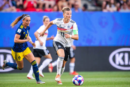 Kosovare Asllani of Sweden and Alexandra Popp of Germany