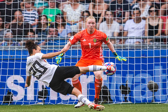 Lina Magull of Germany scores the 1-0 goal behind