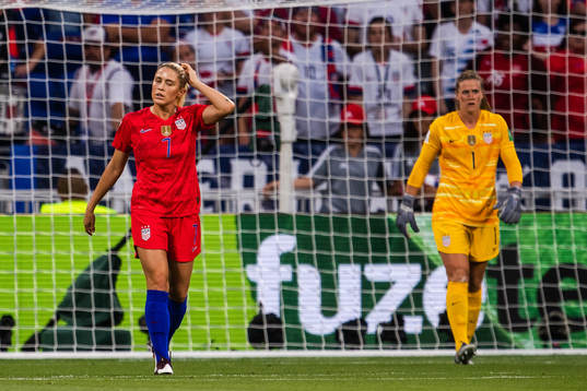 Abigail Dahlkemper and goalkeeper Alyssa Naeher of USA look