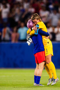 Megan Rapinoe and goalkeeper Alyssa Naeher of USA celebrate