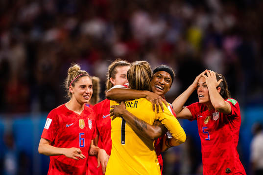 Jessica Mcdonald and goalkeeper Alyssa Naeher of USA