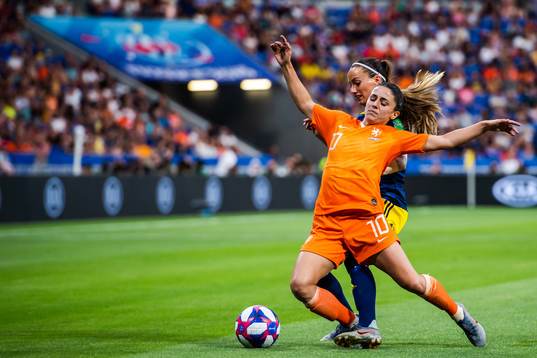 Kosovare Asllani of Sweden and Daniëlle Van De Donk of