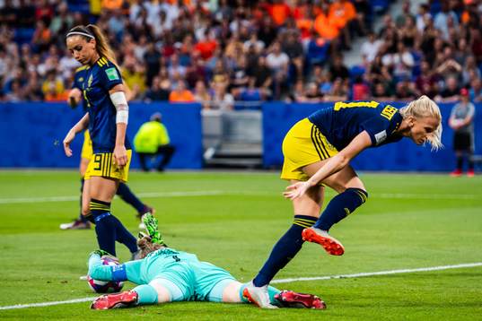 Sofia Jakobsson of Sweden and goalkeeper Sari Van