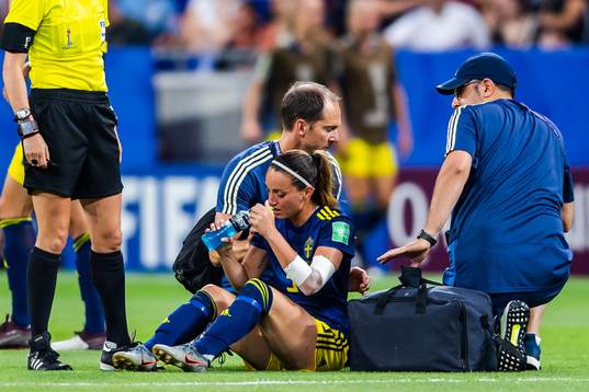 Kosovare Asllani of Sweden receives treatment