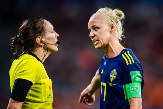 Caroline Seger of Sweden in a conversation with referee