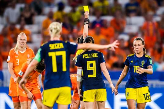 Julia Zigiotti Olme of Sweden is shown a yellow card