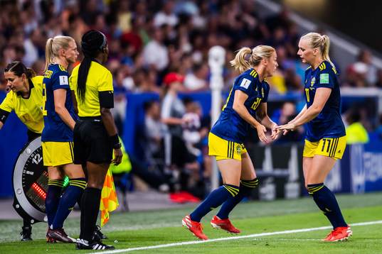 Stina Blackstenius changes with Mimmi Larsson of Sweden