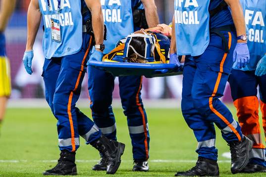 Kosovare Asllani of Sweden is carried of the pitch