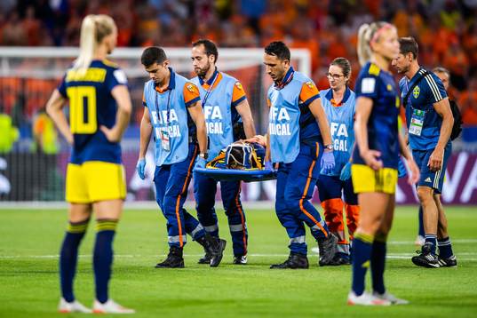 Kosovare Asllani of Sweden is carried of the pitch
