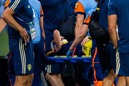 Kosovare Asllani of Sweden is carried of the pitch